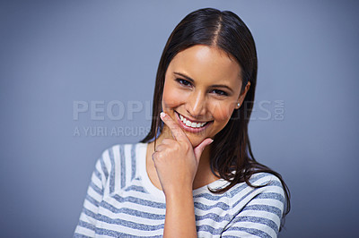 Buy stock photo Woman, happy and positive in studio portrait for university, proud and playful on blue background. Female person, mockup space and smile for student satisfaction, confidence and playful enjoyment