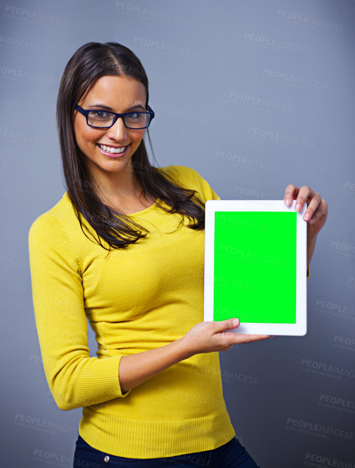 Buy stock photo Woman, tablet and green screen with space for studio portrait with presentation, show or ux by blue background. Student, person and digital touchscreen with chromakey for mockup, app and promotion