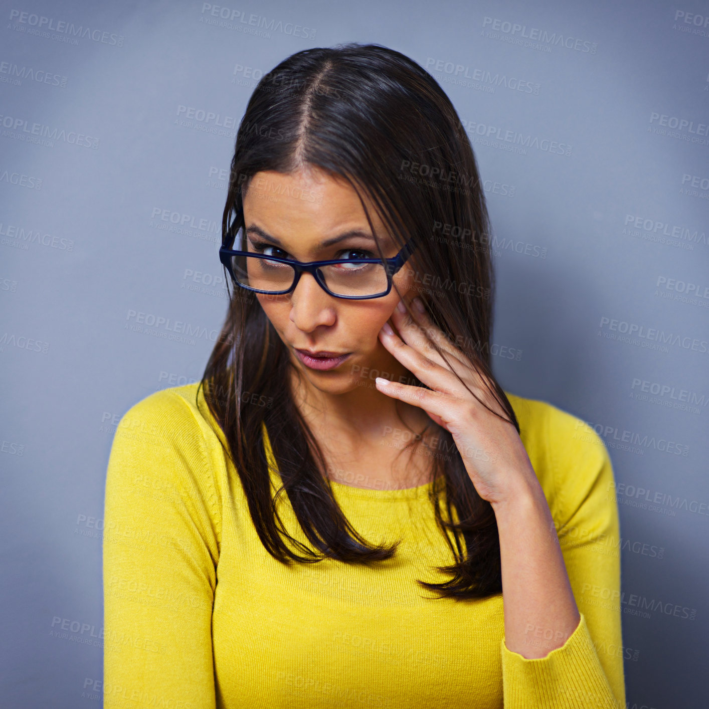 Buy stock photo Woman, surprise and glasses in studio portrait, secret and information on drama by blue background. Female person, eyewear and shock for conflict, announcement and gossip or confession and news