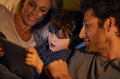 Buy stock photo Bed, parents or kid with tablet for streaming, playing games or watching videos on movie website in home. Social media, child or happy mom with dad or technology to download on ebook online at night