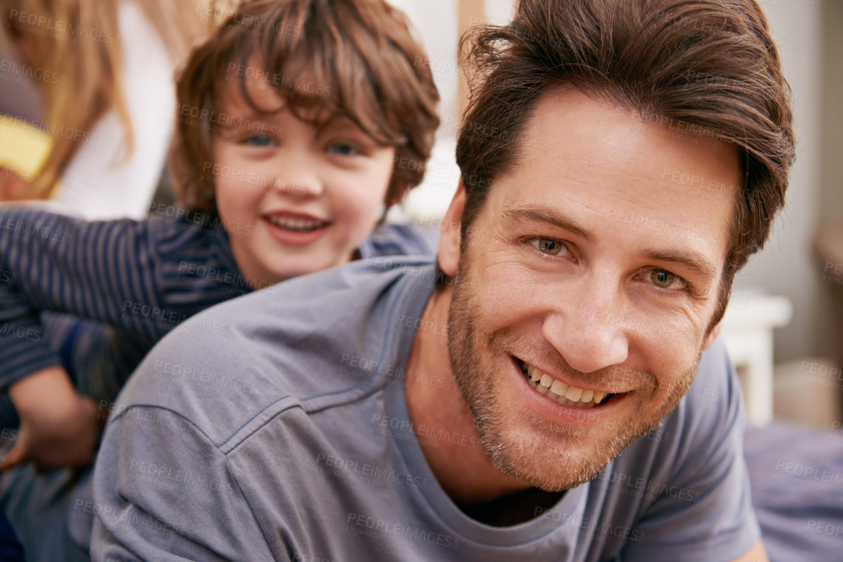 Buy stock photo Happy, portrait and father with child on bed bonding, relaxing and having fun together at modern home. Laughing, smile and dad playing with boy kid in bedroom on weekend at family house in Canada.