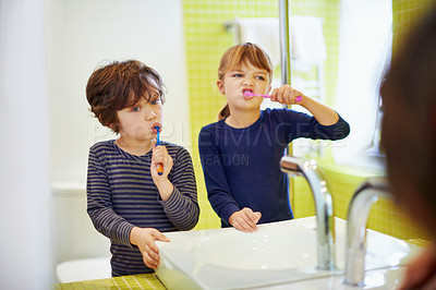 Buy stock photo Children brushing teeth in home bathroom with toothbrush for hygiene and clean mouth. Oral healthcare or fresh breath, kids grooming while bonding and wellness with dental care at sink for dentist