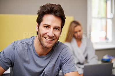 Buy stock photo Man, smile and portrait with partner, bed and laptop for morning internet routine. Happy, couple and home with bedroom, pyjamas and robe together in house with technology for relationship and love