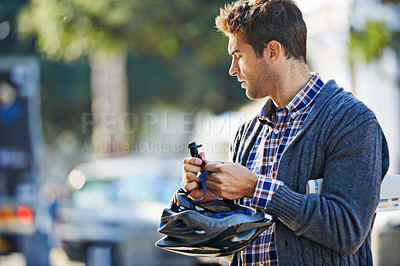 Buy stock photo City, man and cyclist outdoors with helmet for eco friendly transportation, adventure and journey on vacation. Male person, mockup and thinking for weekend travel, cycling and tourism in Amsterdam