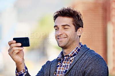 Buy stock photo Photograph, outdoor and man with smartphone, smile and memory with social media and connection. Person, guy in a city and mobile user taking a picture and cellphone with digital app and technology