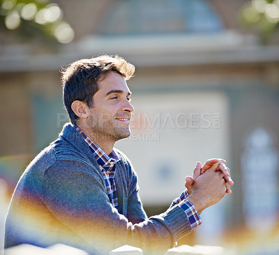 Buy stock photo Man, smile and outside for thinking memory and trip for travel or relax in outdoor for fresh air. Young person, sitting and cheerful and looking for view and break for good mood and joy on vacation  