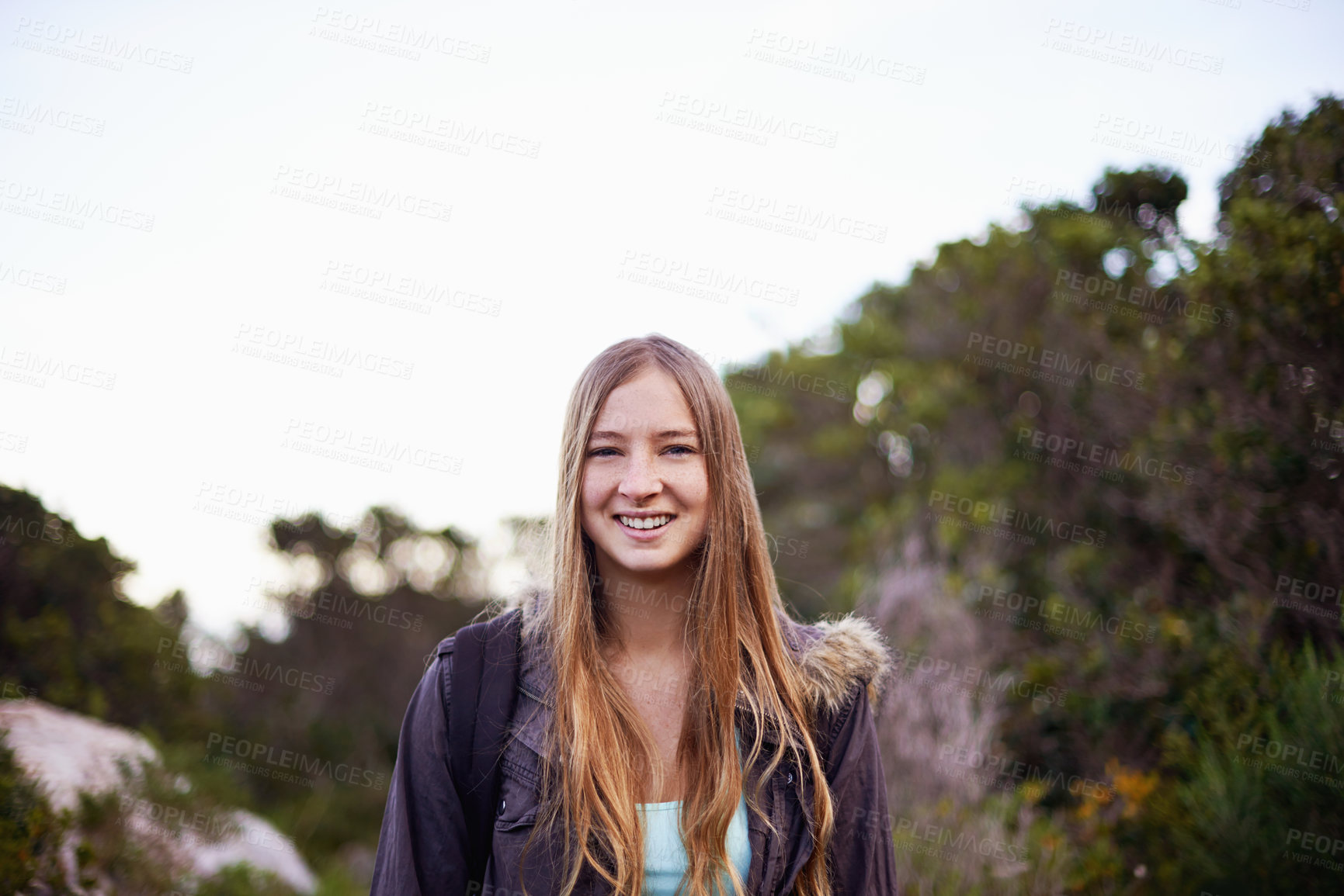 Buy stock photo Outdoor, nature and portrait of girl with smile for hiking with backpack for journey in foliage or bush. Adult, female person and woman with happiness for travel for winter holiday in Cape Town