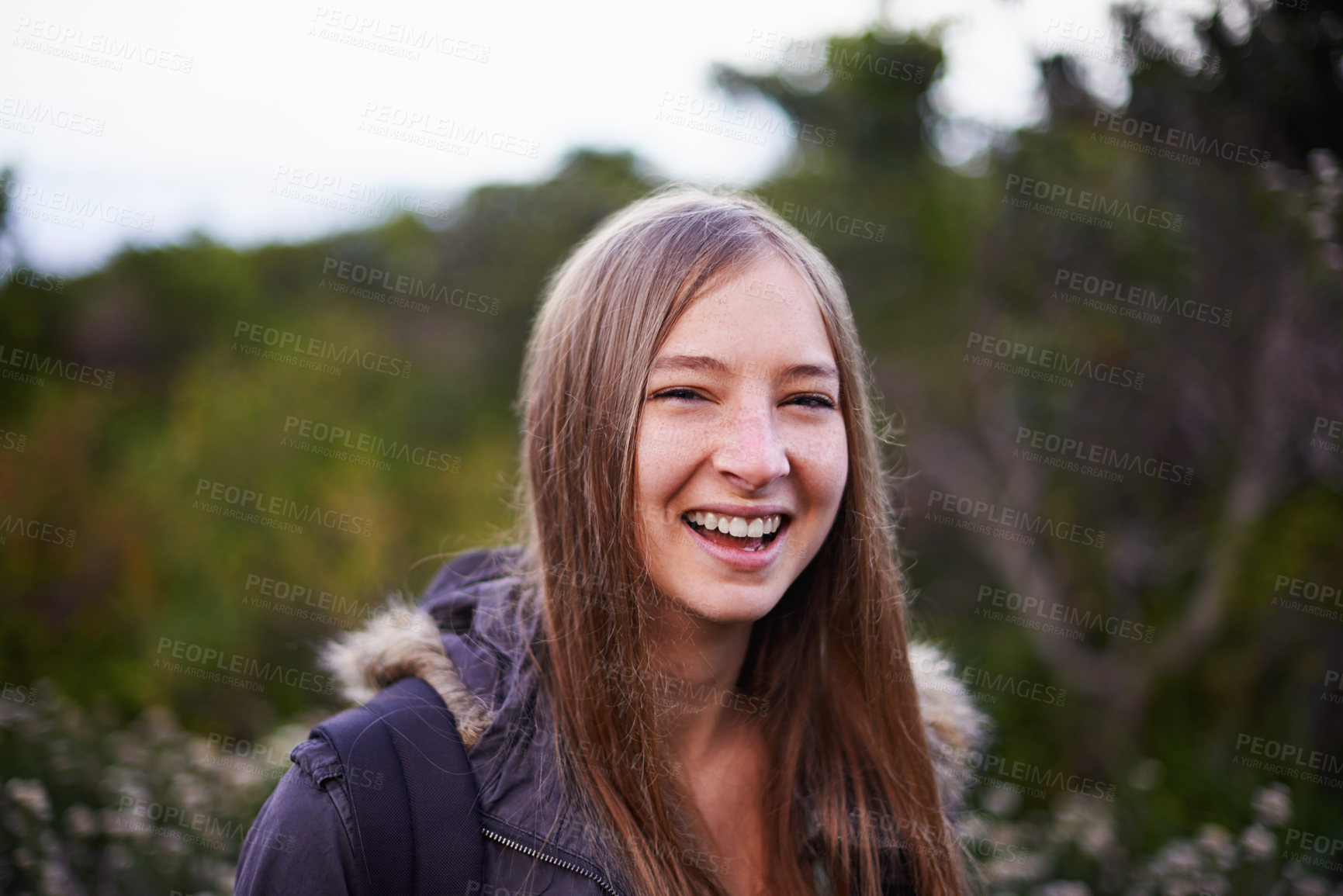 Buy stock photo Outdoor, nature and portrait of girl with backpack for hiking with smile for journey in foliage or bush. Adult, female person and woman with happiness for travel for winter holiday in Cape Town