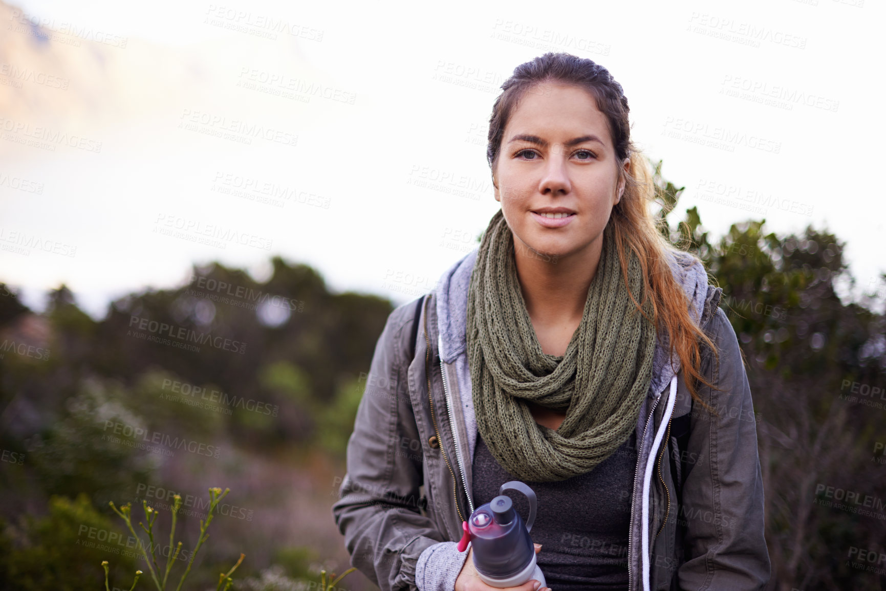 Buy stock photo Woman, hiking and outdoor for portrait with bottle for water with fitness, hydration or smile on adventure. Girl, person and trekking in nature, mountains or bush for journey on vacation in Cape Town