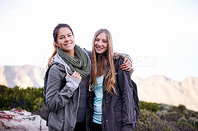 Buy stock photo Friends, smile and portrait for hiking and adventure in nature with mountain for walking outdoor for exercise. Young people, hikers and hugging in landscape with bush and plants for bonding and joy