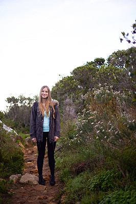Buy stock photo Woman, hiking and outdoor in nature for portrait on path with fitness, smile or adventure on holiday. Girl, person and trekking in bush, mountains and rocks for journey on vacation in Cape Town