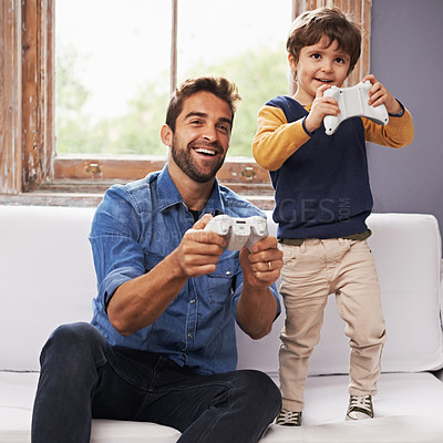 Buy stock photo Love, father and son on a couch, online game and relax at home, playing or carefree in the lounge. Family, dad or boy with parent, kid or male child with controller, gamers or bonding with connection