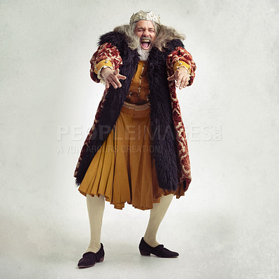 Buy stock photo Shot of a bearded king laughing hysterically