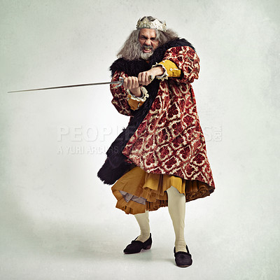 Buy stock photo Man, royalty and portrait of king with sword in studio isolated on a gray background mock up. Vintage victorian, evil and mature mad male, angry ruler and leader holding blade for battle or fight.