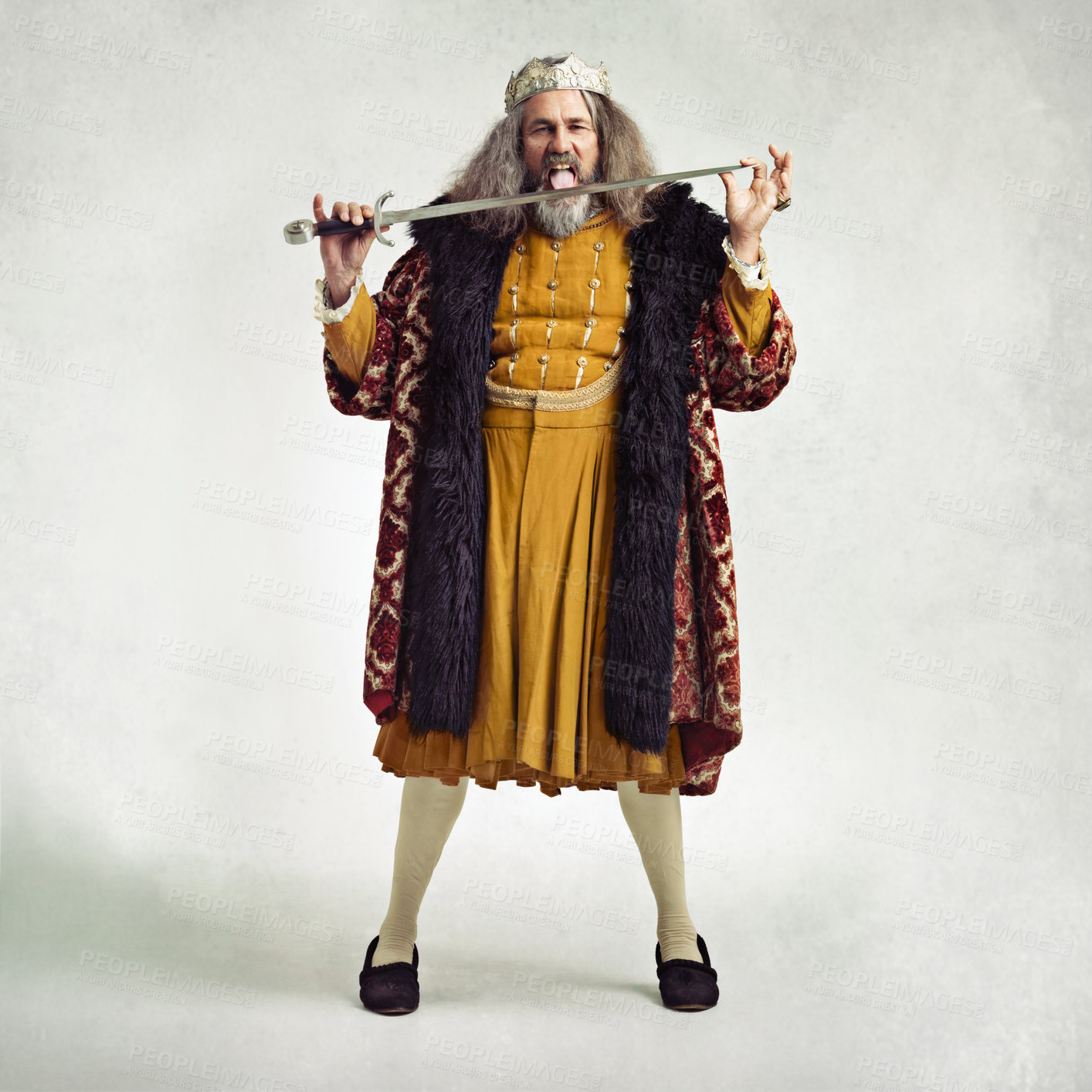 Buy stock photo King, portrait and man lick sword in studio isolated on gray background mockup. Victorian villain, medieval royal and mature male, evil ruler or crazy leader licking steel blade after battle or fight
