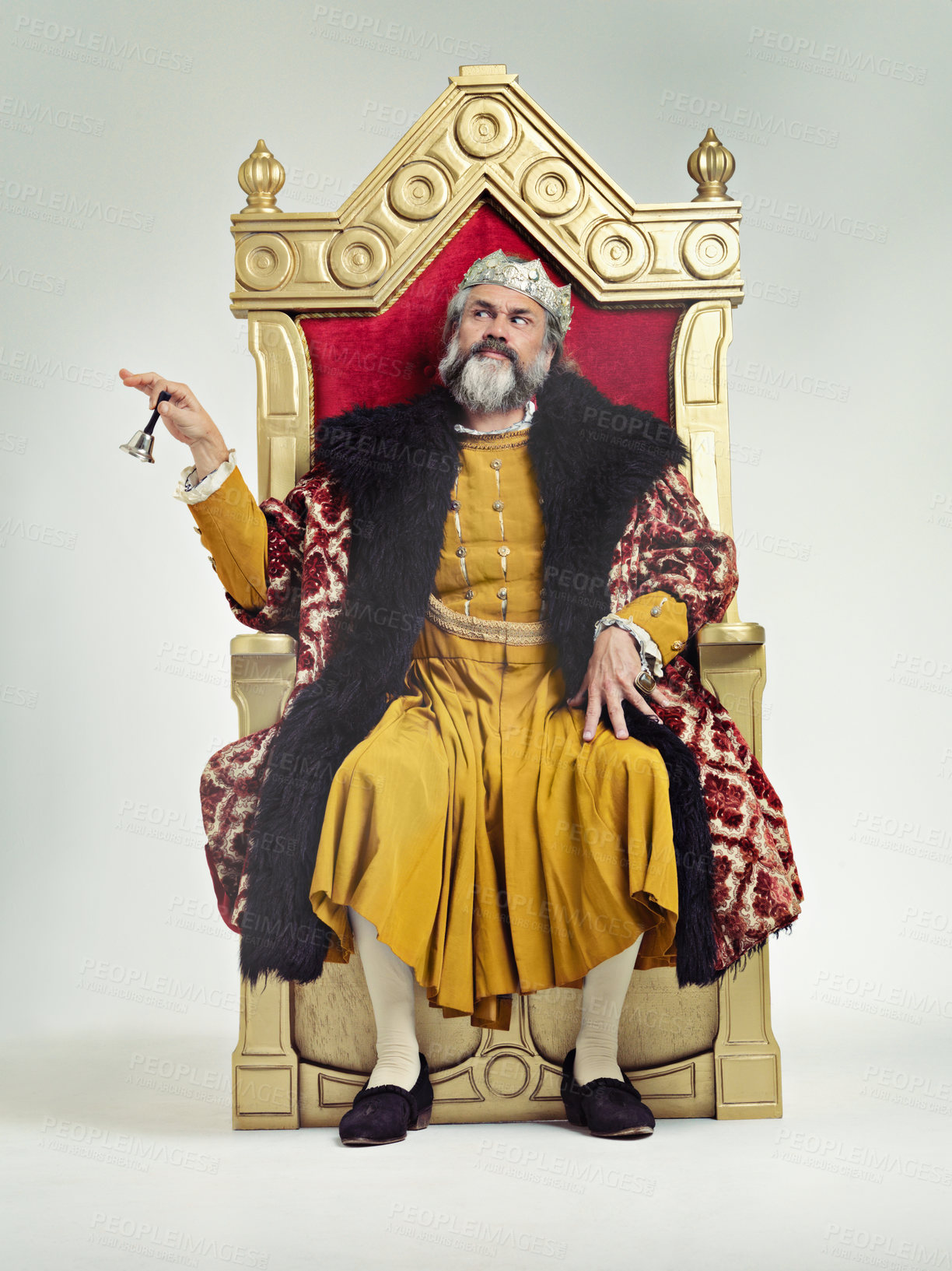 Buy stock photo Studio shot of a richly garbed king sitting on a throne