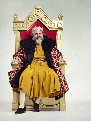Buy stock photo King, royalty and angry man on throne in studio isolated on a gray background mockup.Thinking, medieval and annoyed senior male, upset leader or frustrated ruler with crown sitting on golden seat.