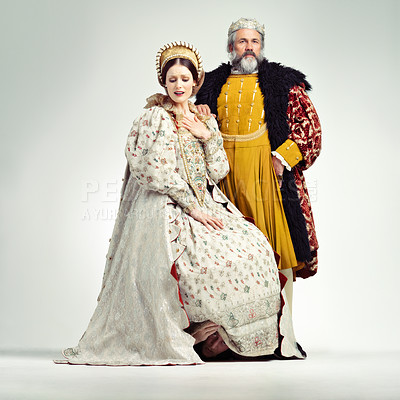 Buy stock photo Studio shot of a regal king and an unhappy queen