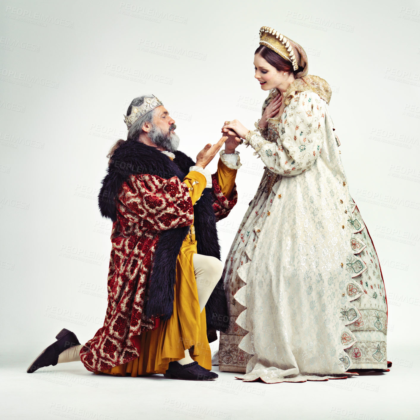 Buy stock photo Studio shot of a king proposing to a royal lady