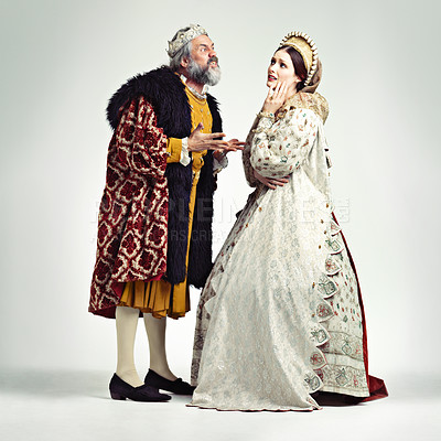 Buy stock photo Anger, medieval and king with queen on a white background for argument, frustrated and fighting. History, theatre and royal couple in vintage, renaissance and Victorian cosplay isolated in studio