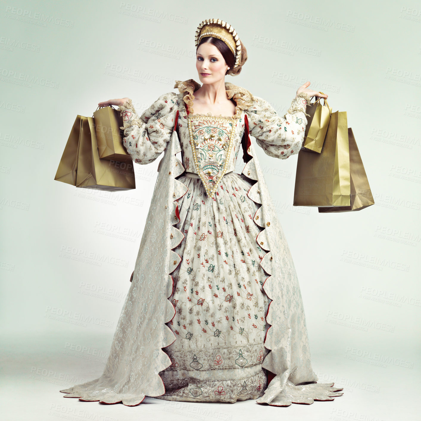 Buy stock photo Fashion, queen and portrait of woman with shopping bags in studio isolated on a gray background. Royalty, sales deals or rich and wealthy female ruler holding luxury golden gifts after buying at mall