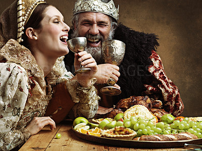 Buy stock photo King, queen and buffet with wine at table for fine dinning in royal banquet, vintage and majestic with crown. Monarch, husband and people together with alcohol and feast for formal celebration