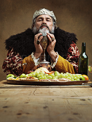 Buy stock photo King, feast and wine glass in table as royalty on dining hall for tradition, culture and meal in palace. Portrait, monarch and food with eating buffet or supper in confidence as majesty and crown 