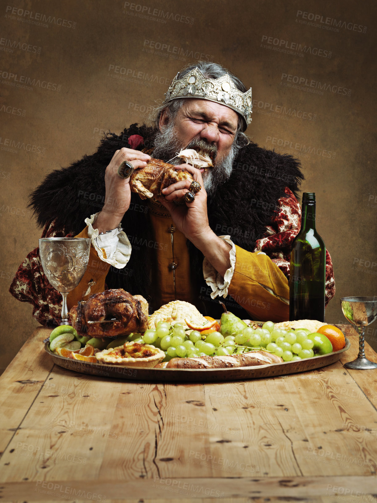 Buy stock photo A mature king feasting alone in a banquet hall