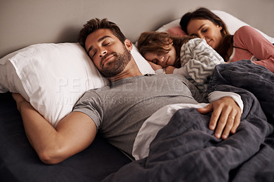Buy stock photo Parents, child and bed for sleep, dream and tired for rest,  young and growing up for break indoor. Girl or kid with mom and dad and laying with pajamas for exhausted in house for peace and calm