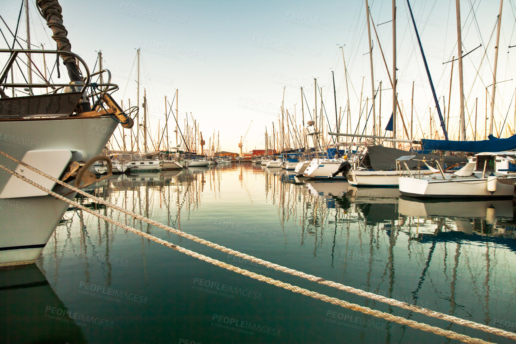 Buy stock photo A photo of a harbor with anchored ships.