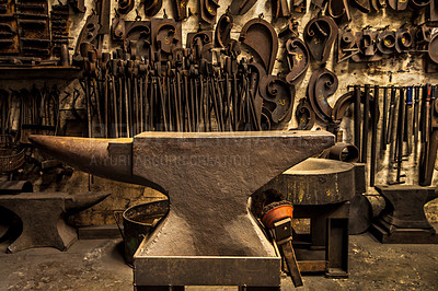 Buy stock photo Workshop, metal tools and anvil in forge with wall background for industry, manufacturing or development. Retro factory, workspace or industrial for steel, iron or product with vintage craftsmanship