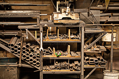 Buy stock photo Shot of a metal craftsman's workshop filled with metal tools