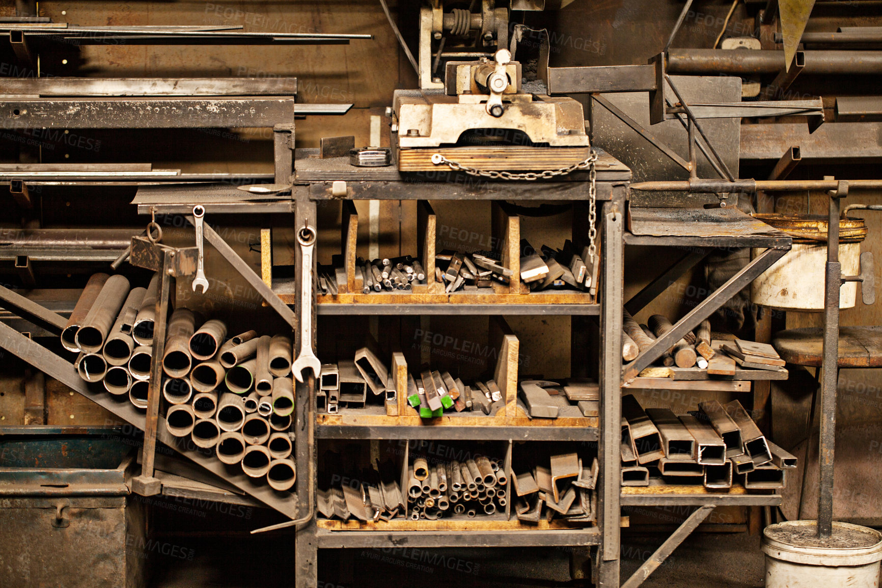 Buy stock photo Shot of a metal craftsman's workshop filled with metal tools