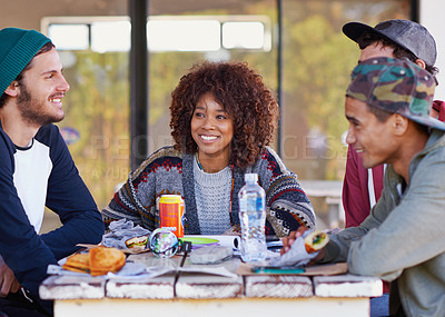 Buy stock photo Friends, group and outdoor table for eating lunch together on backyard patio for bonding, relaxing or connection. Men, women and smile with beverages for community gathering, communication or snack