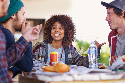 Buy stock photo Friends, group and outdoor talking for eating lunch together on backyard patio for bonding, relaxing or connection. Men, women and smile with beverages for community gathering, communication or snack