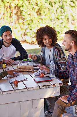 Buy stock photo Study, table and group of university friends with food, conversation or social support in education. Books, tablet and happy students relax together on patio with diversity, lunch and college 
