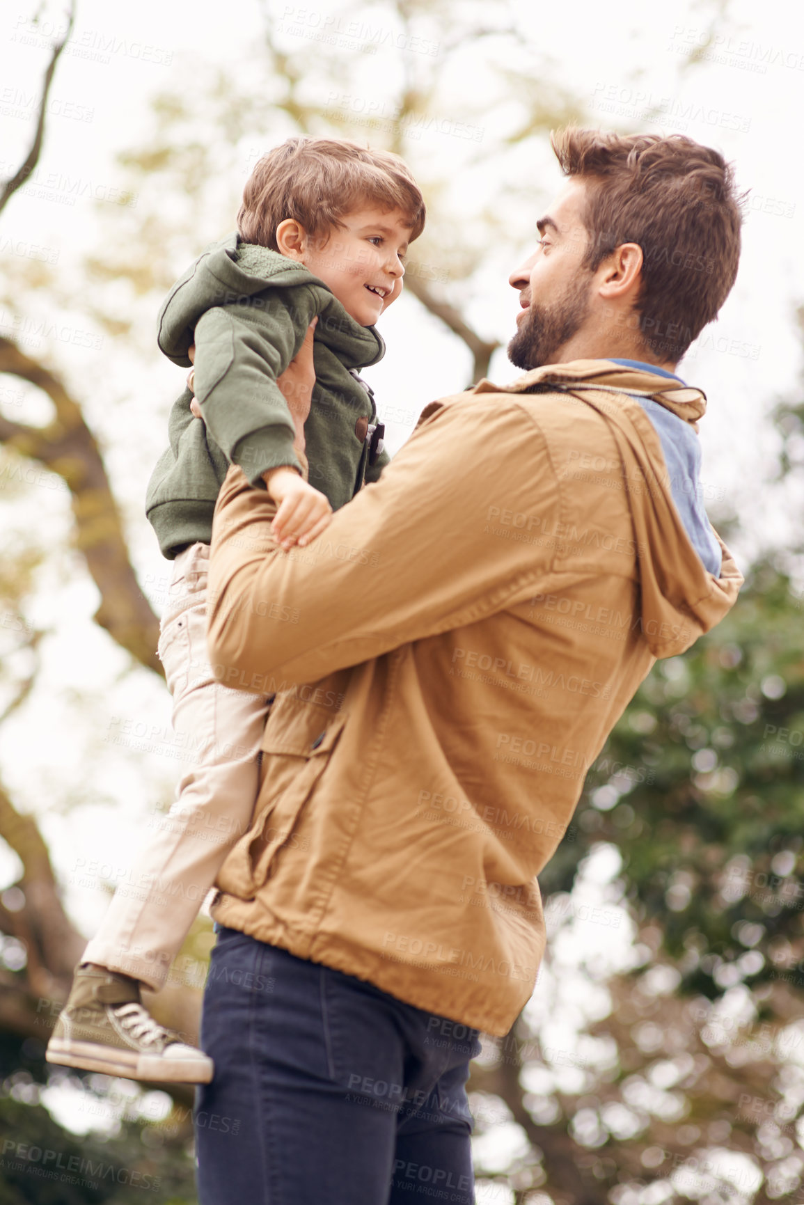 Buy stock photo Father, child and love in nature for outdoor bonding connection in forest for autumn happiness, joy or care. Male person, son and holding in woods for holiday vacation or trees, family or together