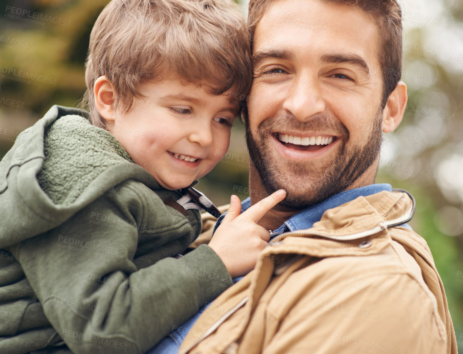 Buy stock photo Shot of a father and son enjoying a day outdoors