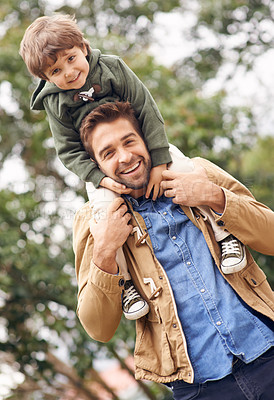Buy stock photo Shot of a father and son enjoying a day outdoors