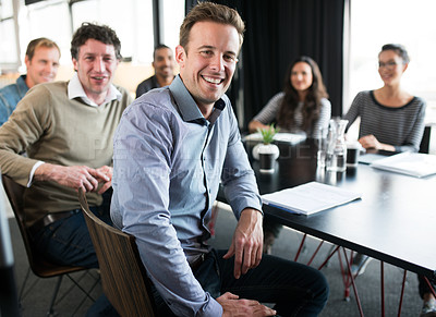 Buy stock photo Happy, portrait and businessman in meeting at office with teamwork, collaboration and cooperation on project. Professional, group and man with notes for planning or agenda for London company progress