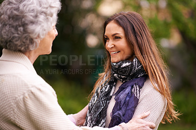 Buy stock photo Smile, care and woman with grandmother together on a outdoor vacation or holiday bonding in happiness. Retirement, women and young happy female person in conversation and laughing with mom