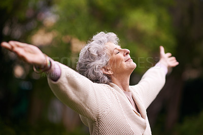 Buy stock photo Shot of a senior woman enjoying the outdoors