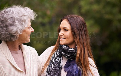 Buy stock photo Talking, outdoor and woman with elderly mother together on a nature vacation or holiday bonding in happiness. Retirement, women and young happy female person in conversation and with mom in a garden