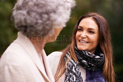 Buy stock photo Smile, grandmother and woman with elderly parent together on a outdoor vacation or holiday bonding in happiness. Retirement, women and young happy female person in conversation and laughing with mom