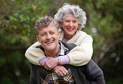Buy stock photo Portrait, retired people, smile on piggyback to relax in nature park as bonding together on holiday. Happy, older couple or love on fun vacation or walk as romantic date in retirement getaway