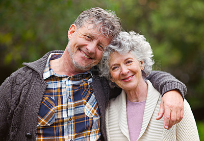 Buy stock photo Portrait of a loving senior couple standing together outdoors