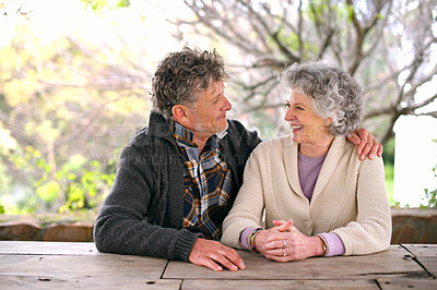 Buy stock photo Happy, outdoor and senior couple with support and love on holiday or relax on vacation in retirement. Elderly, man and woman embrace in backyard, garden of home and talking with care in marriage