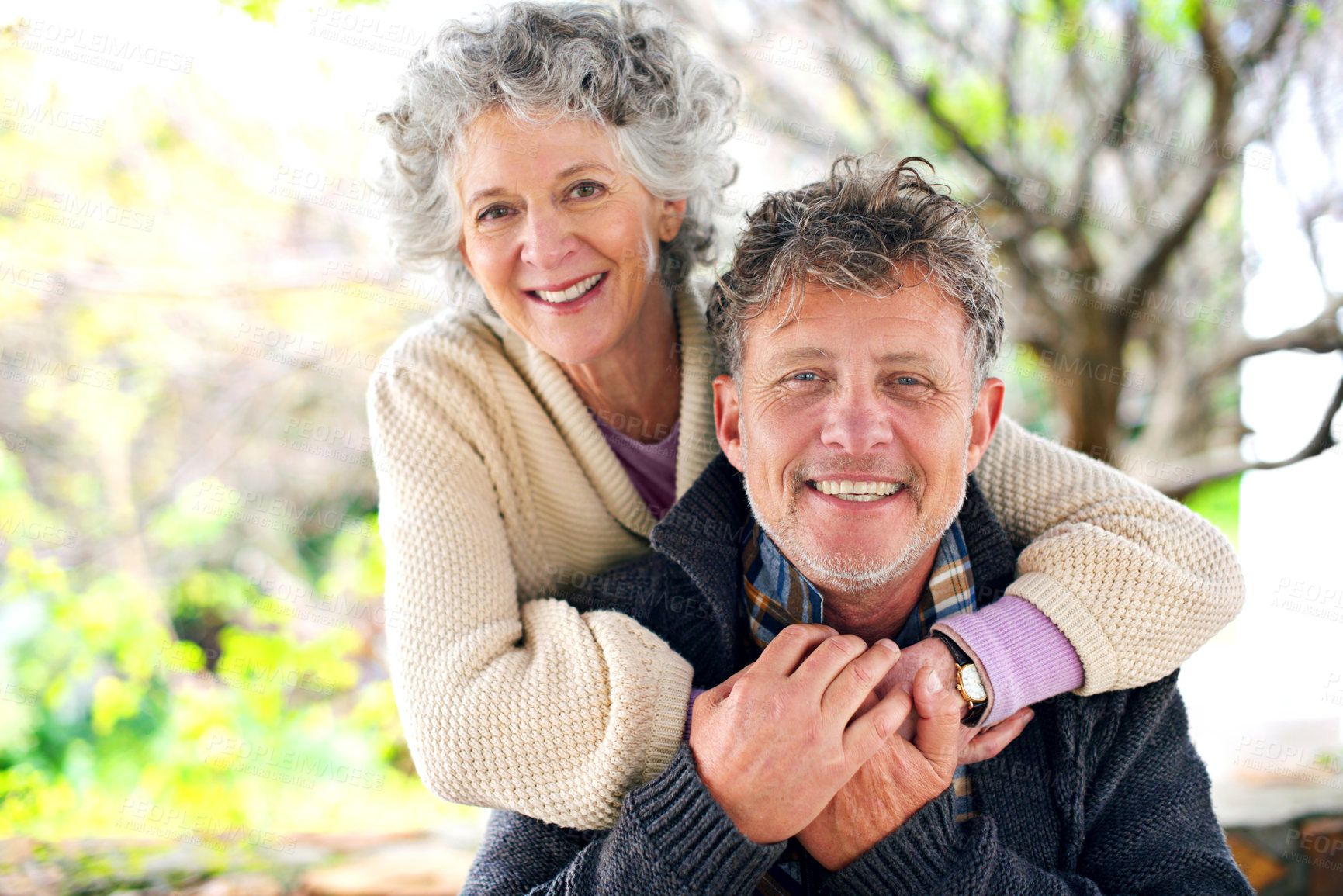 Buy stock photo Happy, portrait and senior couple hug outdoor with love on holiday or relax on vacation in retirement. Elderly, man and woman in embrace in backyard or garden of home with care or support in marriage