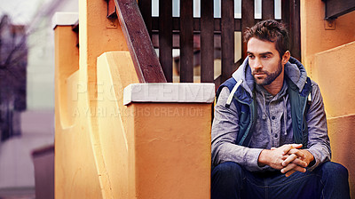 Buy stock photo Fashion, relax or man on steps thinking of casual clothes, style or edgy hoodie for winter outdoor outfit. House, cool model or stylish male person in urban street on stairs in trendy jacket in Spain