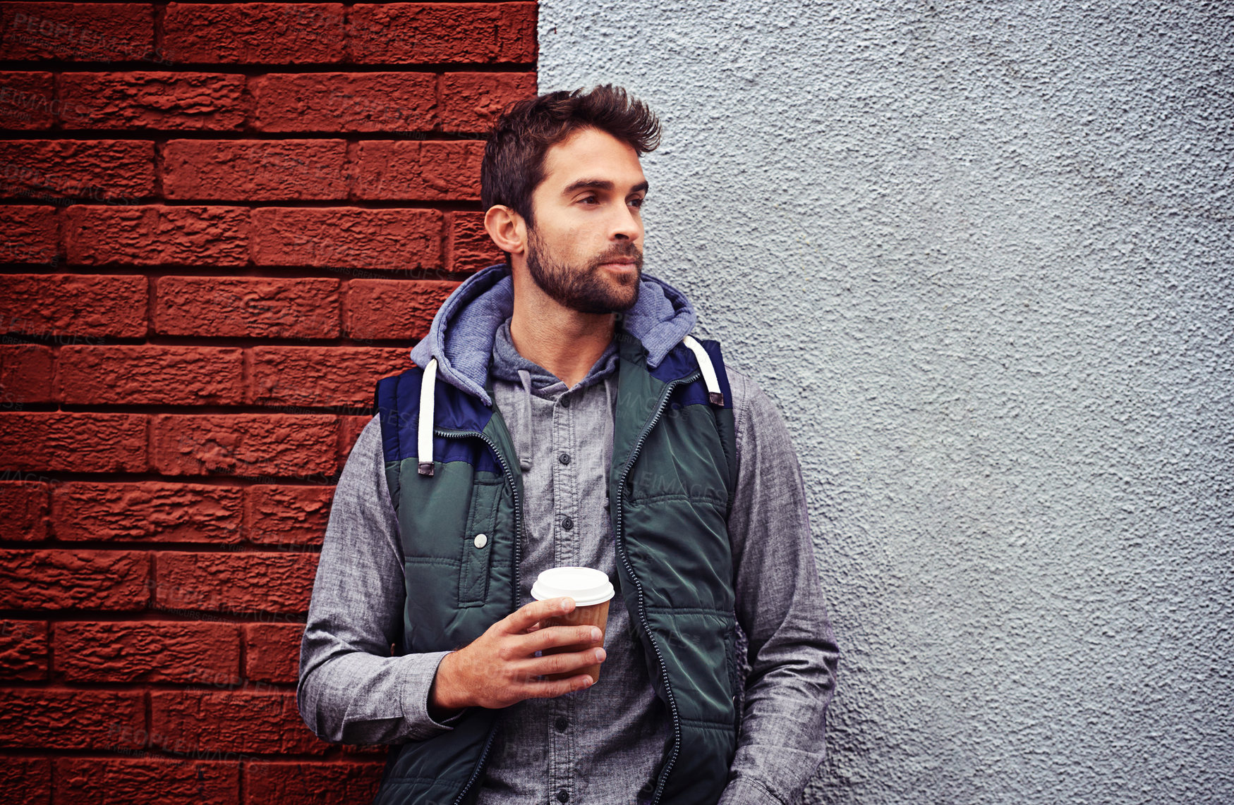 Buy stock photo Fashion, wall or man with coffee thinking of casual clothes, style or edgy hoodie for winter outdoor outfit. Tea, cool model or stylish person in urban town in streetwear or trendy jacket in Italy